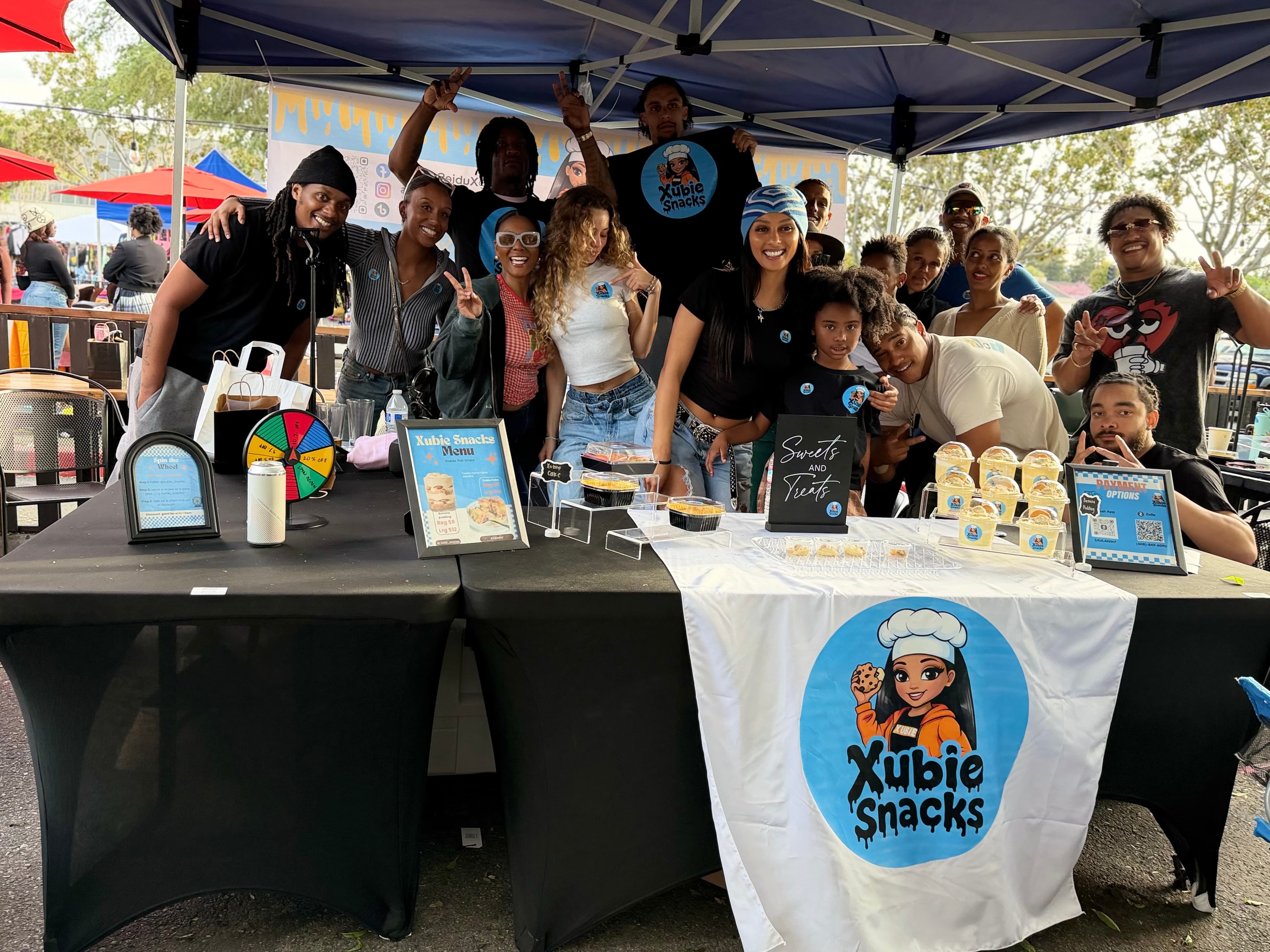 Xubie Snacks full booth setup at a community event